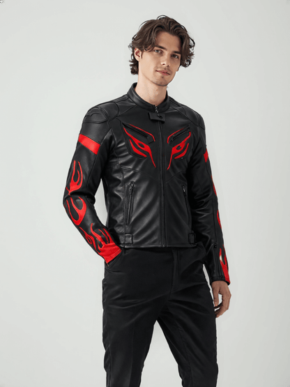 Close-up of the chest area of a black leather motorcycle jacket, highlighting the red tribal eye-like design and sleek stitching details.

