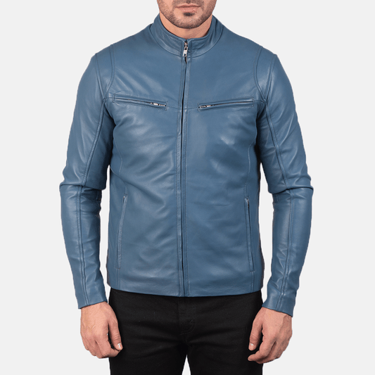 A man wearing a turquoise blue leather motorcycle jacket with a mandarin collar, zipper details, and embroidered leather accents on the arms.